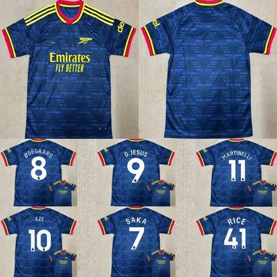 Blue football shirts arranged in a grid, one full shirt above six squad shirts printed with player names and numbers